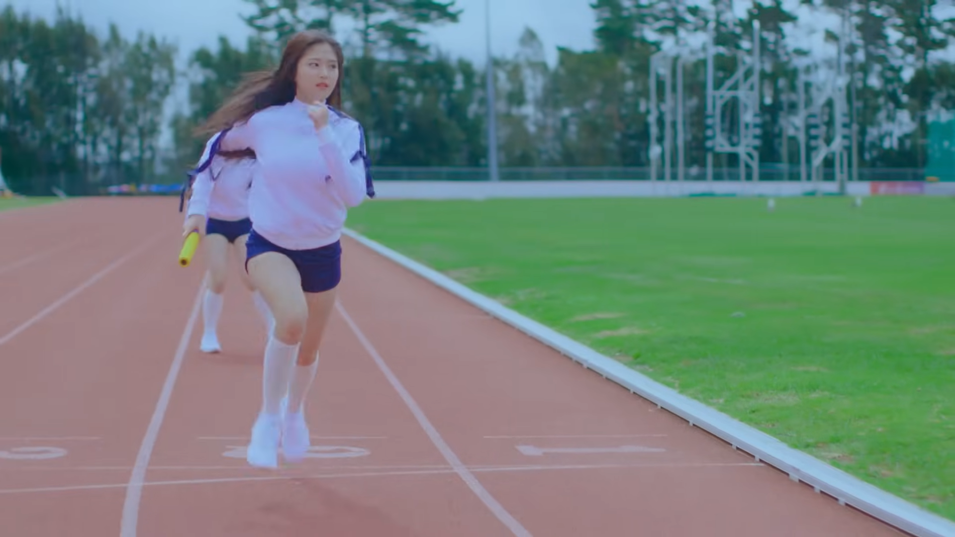 Hyunjin running on the track.